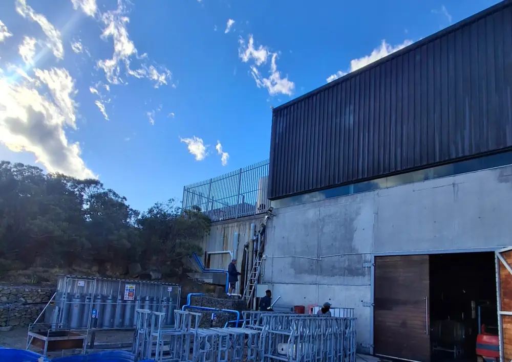 Commercial plumbing maintenance on a warehouse building