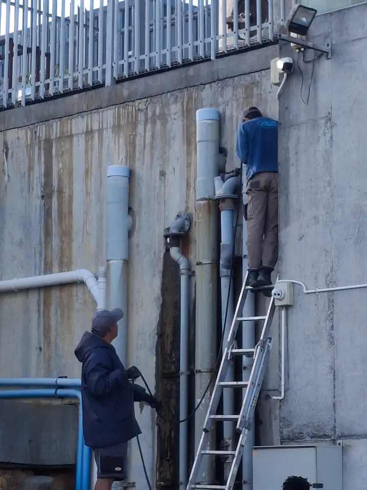 Vic's Plumbing working on soil stacks and waste pipework on a commercial building